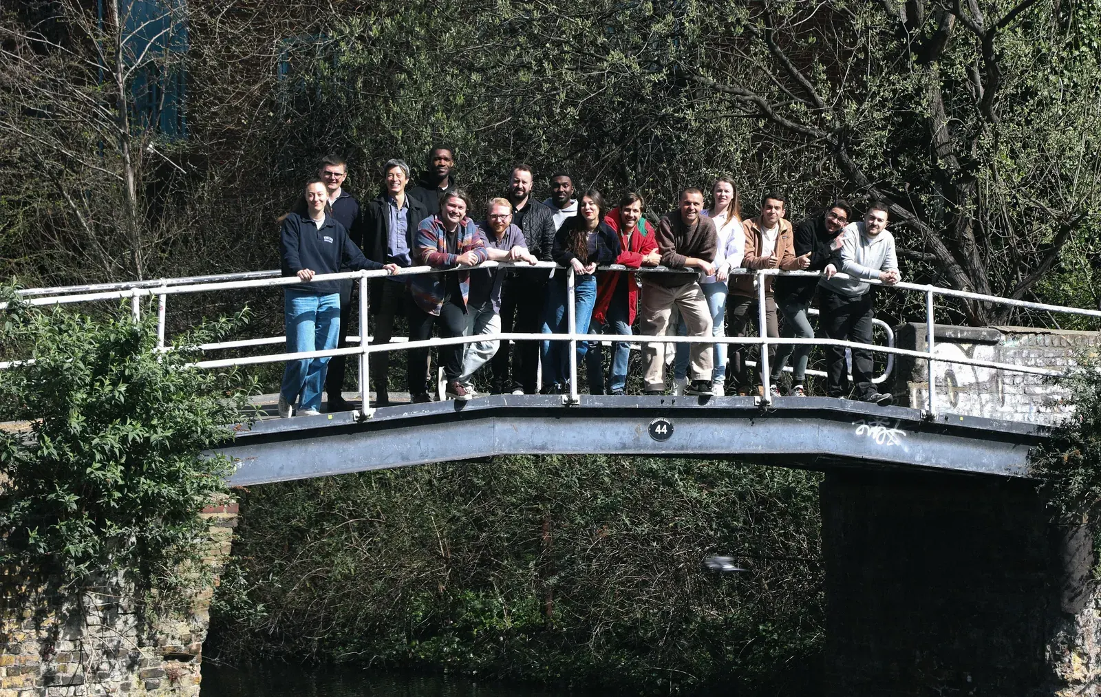 The inploi team together on a canal footbridge